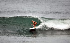 Woman surfing in the pocket of the wave